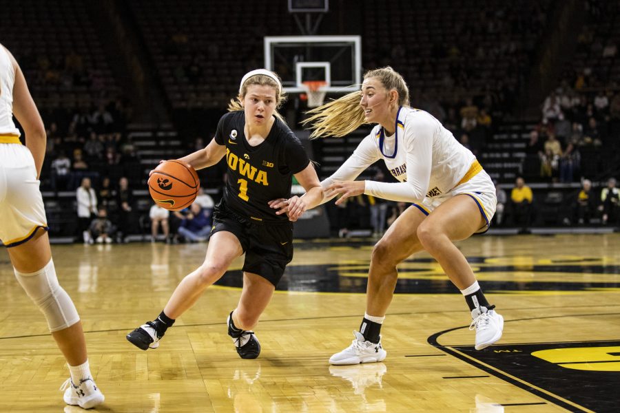 Iowa guard Molly Davis drives to the hoop during a women’s exhibition basketball game between Iowa and Nebraska-Kearney at Carver-Hawkeye Arena on Friday, Oct. 28, 2022. David played for 25 minutes and 38 seconds. The Hawkeyes defeated the Lopers, 108-29. 