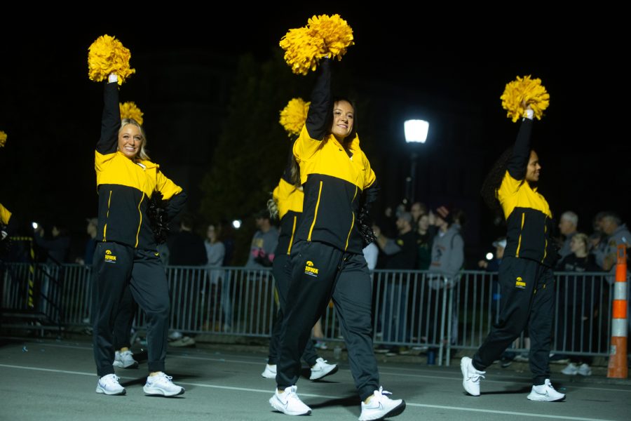 The University of Iowa Dance Team marches in the University of Iowa Homecoming Parade and Pep Rally in Iowa City on Friday, Oct. 28, 2022.