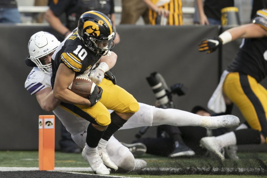 Iowa wide receiver Arland Bruce scores a tocuhdown during a football game between Northwestern and Iowa at Kinnick Stadium on Saturday, Oct. 29, 2022. Iowa defeated Northwestern, 33-13. Bruce recorded two catches and 22 receiving yards.
