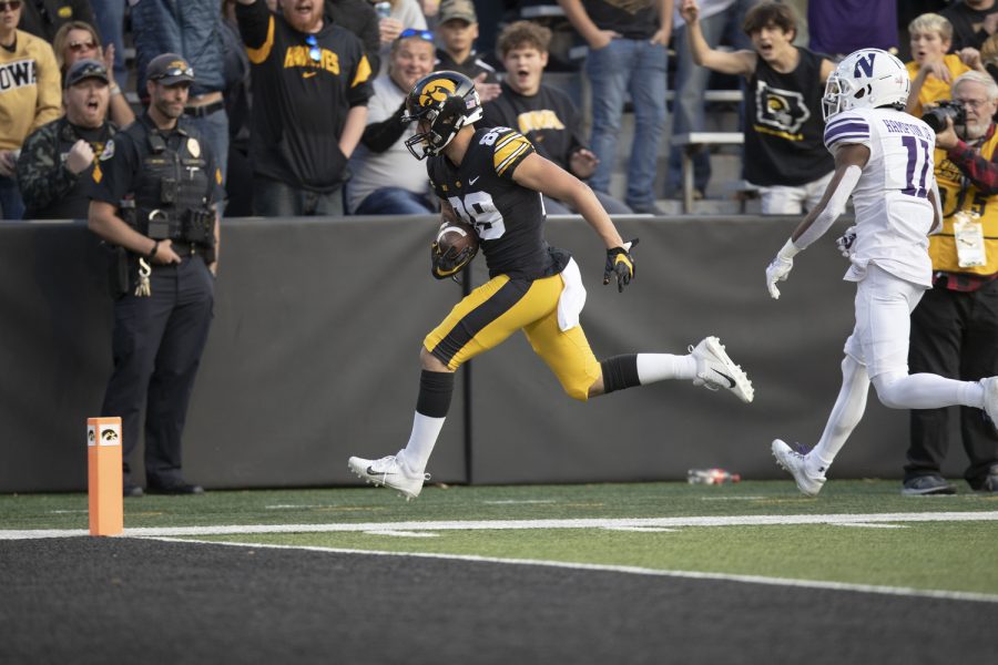 Iowa wide receiver Nico Ragaini runs with the ball during a football game between Northwestern and Iowa at Kinnick Stadium on Oct. 29, 2022. Iowa defeated Northwestern, 33-13. Ragini recorded four catches and 66 receiving yards.