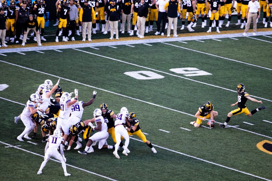 Iowa kicker Drew Stevens kicks the ball during a football game between Iowa and Northwestern at Kinnick Stadium on Saturday, Oct. 29, 2022. Iowa defeated Northwestern, 33-13.