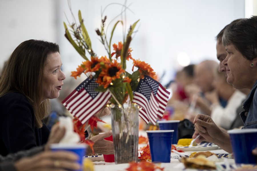 Iowa State representative Christina Bohannan speaks to attendees while eating at the Johnson County Democrats Barbecue Oct. 9, 2022. 