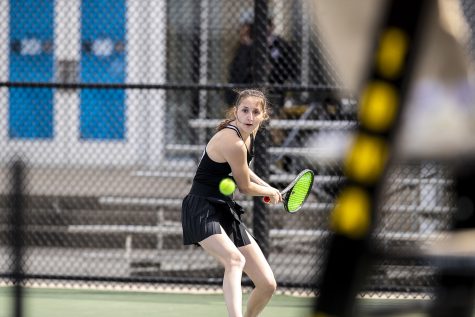 Iowa’s Marisa Schmidt eyes the ball before she hits a shot during a women’s tennis match between Iowa and Michigan State at the Hawkeye Tennis & Recreation Complex on Wednesday, April 27, 2022. The Hawkeyes defeated the Spartans, 4- 3. 