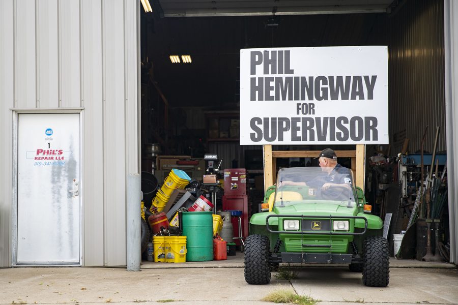 Phil backs up his campaign vehicle into Phil’s Repair after a day of work. The vehicle often follows him on various campaign events and parades. (Ayrton Breckenridge/The Daily Iowan)