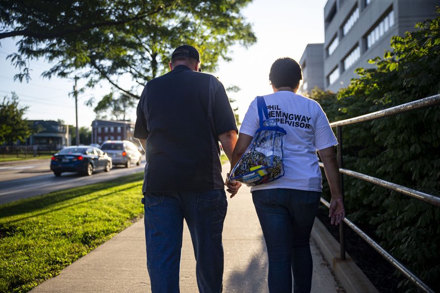 After a day of working and campaigning, Phil and Anita walk to Kinnick Stadium for Clash at Kinnick. Most days, the couple both go to their separate jobs and don’t see each other until the evening. (Ayrton Breckenridge/The Daily Iowan)