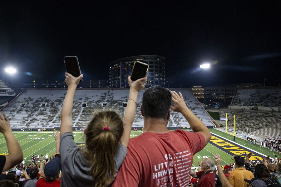 Fans wave to the University of Iowa Stead Family Children's Hospital during Clash at Kinnick on Friday, Aug. 26, 2022. Phil and Anita regularly attended Iowa football games when their daughter marched for the Hawkeye Marching Band. (Ayrton Breckenridge/The Daily Iowan)