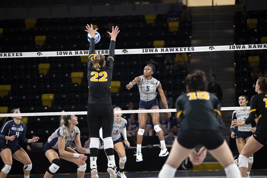North+Florida+outside+hitter+Mahalia+White+spikes+the+ball+while+Iowa+outside+hitter+Addie+VanderWeide+blocks+the+ball++during+a+volleyball+match+between+Iowa+and+North+Florida+at+Xtream+Arena+in+Coralville+on+Friday%2C+Sept.+16%2C+2022.+The+Hawkeyes+defeated+the+Ospreys+3-0.+