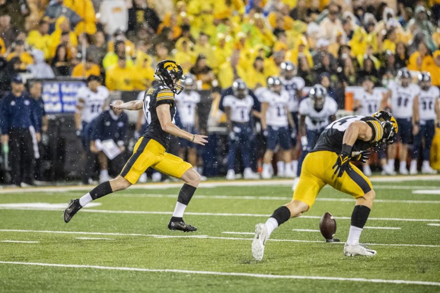 Iowa kicker Drew Stevens kicks the ball during a kickoff in a near seven-hour football game between Iowa and Nevada at Kinnick Stadium in Iowa City on Saturday, Sept. 18, 2022. The Hawkeyes defeated the Wolfpack, 27-0. 