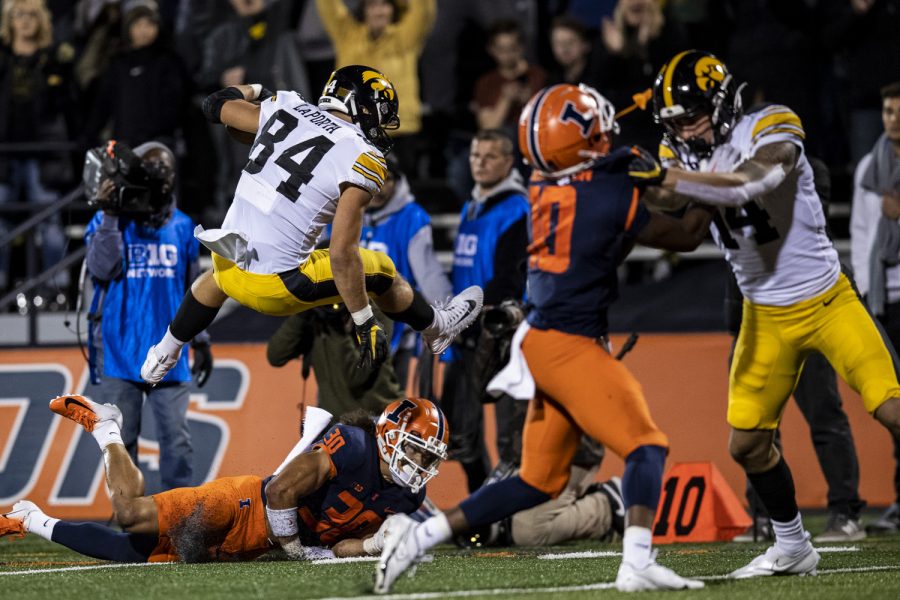 Iowa tight end Sam LaPorta hurdles Illinois defensive back Sydney Brown during a football game between Iowa and Illinois at Memorial Stadium in Champaign, Ill., on Saturday, Oct. 8, 2022.