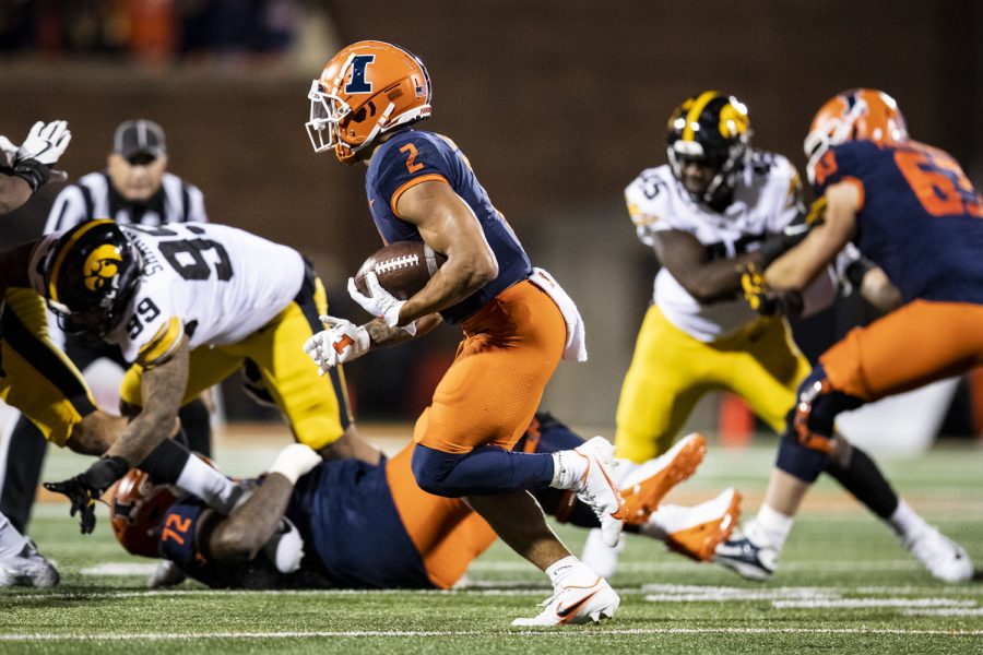 Illinois running back Chase Brown carries the ball during a football game between Iowa and Illinois at Memorial Stadium in Champaign, Ill., on Saturday, Oct. 8, 2022.