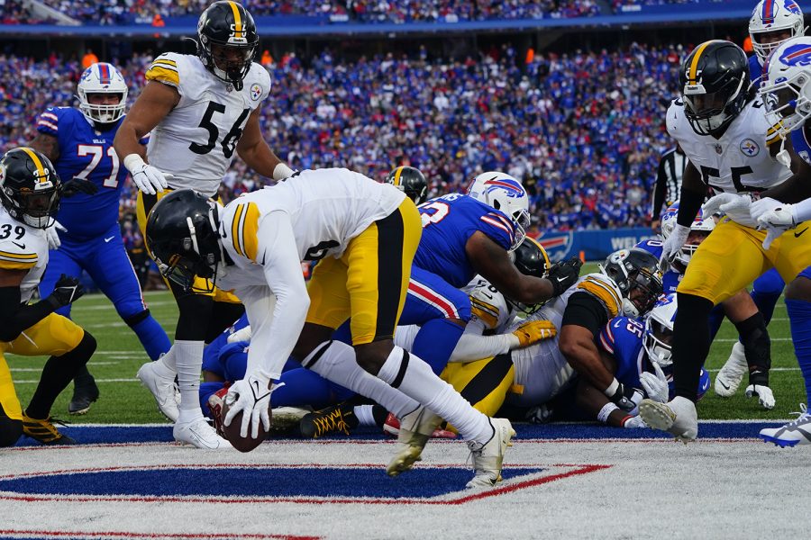 Oct 9, 2022; Orchard Park, New York, USA; Pittsburgh Steelers cornerback Josh Jackson (16) recovers a fumble by Buffalo Bills tight end Quintin Morris (85) during the second half at Highmark Stadium.