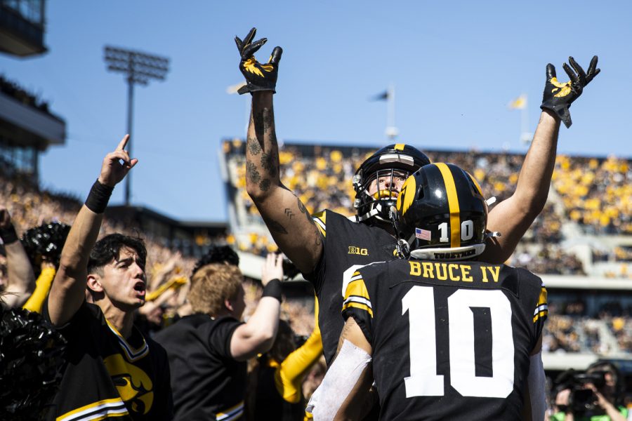 Iowa+wide+receiver+Nico+Ragaini+lifts+his+hands+up+to+celebrate+with+wide+receiver+Arland+Bruce+IV+during+a+football+game+between+Iowa+and+No.+4+Michigan+at+Kinnick+Stadium+in+Iowa+City+on+Saturday%2C+Oct.+1%2C+2022.+Ragaini+and+the+offense+celebrated+the+play+as+a+touchdown+before+refs+signaled+Ragaini+had+stepped+out+of+bounds.+The+Wolverines+defeated+the+Hawkeyes%2C+27-14.