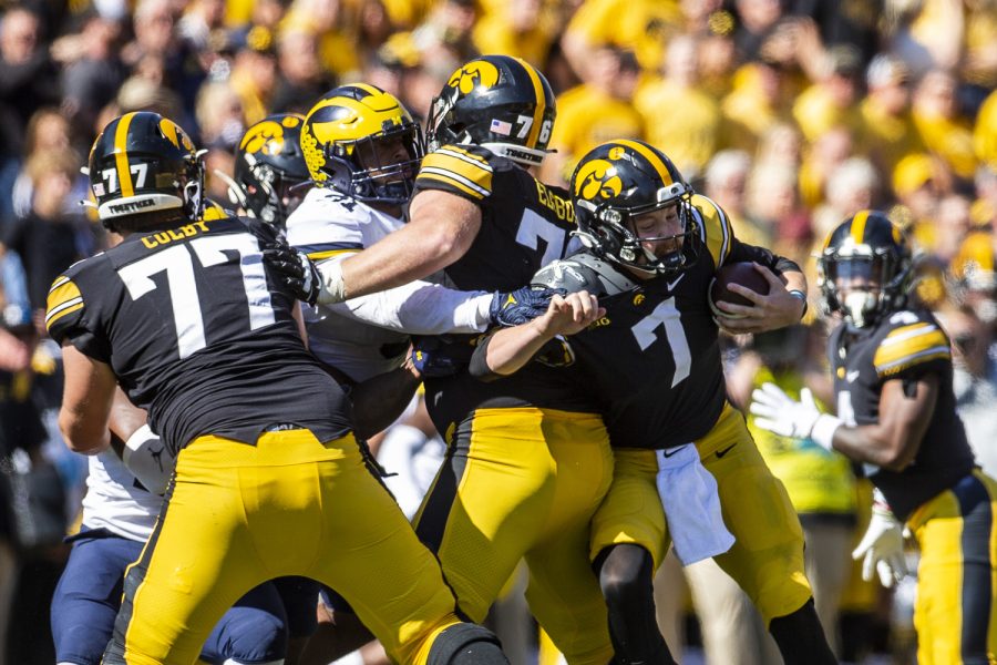 Michigan+defensive+lineman+Taylor+Upshaw+grabs+Iowa+quarterback+Spencer+Petras+during+a+football+game+between+Iowa+and+No.+4+Michigan+at+Kinnick+Stadium+in+Iowa+City+on+Saturday%2C+Oct.+1%2C+2022.+Petras+was+sacked+Petras+four+times+causing+the+Iowa+offense+to+lose+31+yards.+The+Wolverines+defeated+the+Hawkeyes%2C+27-14.