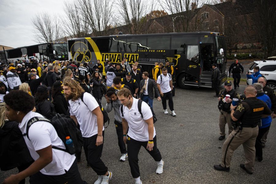 Iowa football players walk off the team bus ahead of Iowas game against Purdue at Ross-Ade Stadium in West Lafayette, Indiana, on Saturday, November 5, 2022. Purdue has won four of the past five matchups against Iowa.