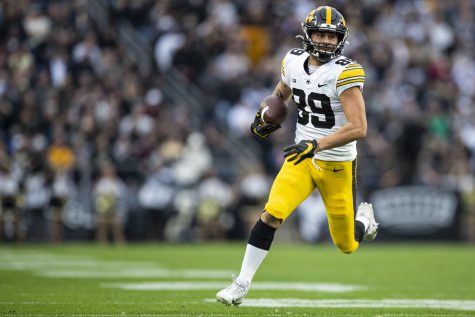 Iowa wide receiver Nico Ragaini (89) runs after a reception  during a football game between Iowa and Purdue at Ross-Ade Stadium in West Lafayette, Ind., on Saturday, Nov. 5, 2022.