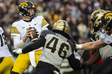Iowa quarterback Spencer Petras (7) prepares to throw the ball during a football game between Iowa and Purdue at Ross–Ade Stadium in West Lafayette, Ind., on Saturday, Nov. 5, 2022. Petras averaged 8.3 yards per pass. The Hawkeyes defeated the Boilermakers, 24-3.