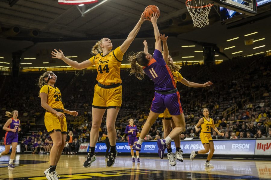 Iowa forward Addison O’ Grady jumps to block Evansville guard Elly Morgan during a women’s basketball game between Iowa and Evansville at Carver-Hawkeye Arena in Iowa City on Thursday, Nov. 10, 2022. The Hawkeyes defeated the Purple Aces 115-62.