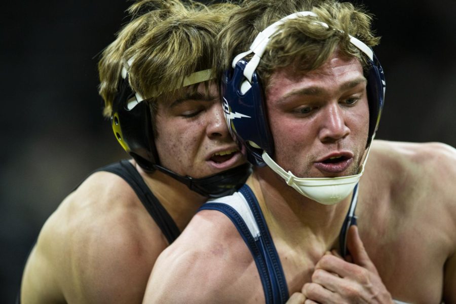 Iowa’s 174-pound Drake Rhodes grapples with Cal Baptist’s Zachary Rowe during a wrestling meet between Iowa and Cal Baptist at Carver-Hawkeye Arena on Sunday, Nov. 13, 2022. Rhodes defeated Rowe by major decision, 13-4. The Hawkeyes defeated the Lancers, 42-3. 