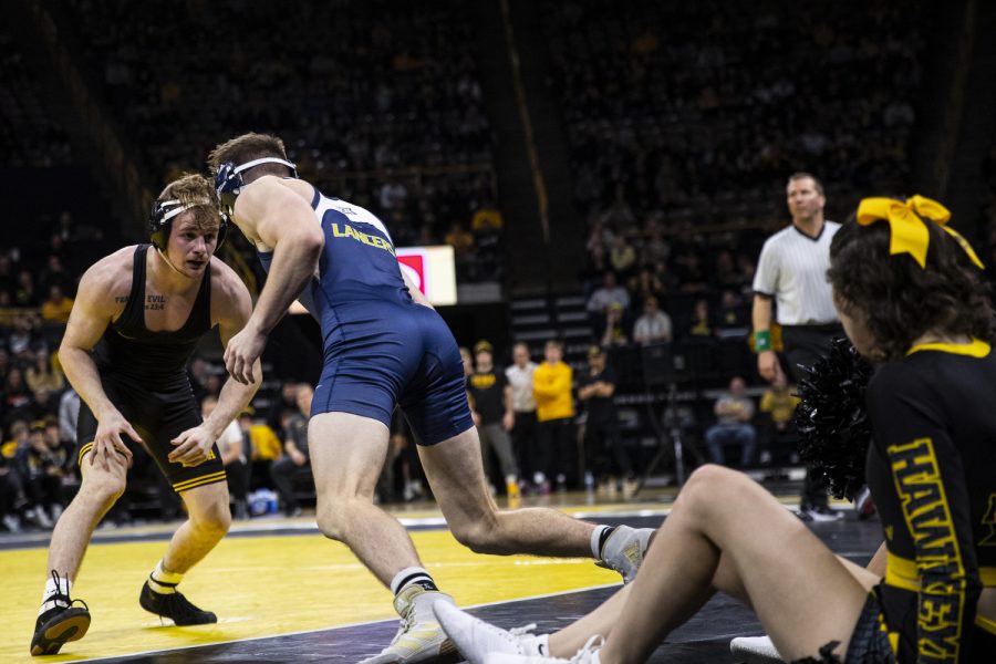 Iowa’s Brody Teske squares up Cal Baptist’s Hunter Leake during a wrestling meet between Iowa and Cal Baptist at Carver-Hawkeye Arena on Sunday, Nov. 13, 2022. The former University of Northern Iowa Panther, Brody Teske, defeated Leake by decision, 6-4. The Hawkeyes defeated the Lancers, 42-3. 
