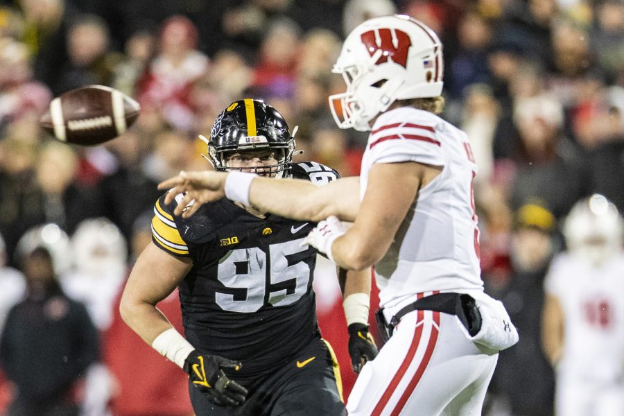 Iowa defensive lineman Aaron Graves pressures Wisconsin quarterback Graham Mertz’ pass during a football game between Iowa and Wisconsin at Kinnick Stadium in Iowa City on Saturday, Nov. 12, 2022. Mertz connected on just 45 percent of his passes. The Hawkeyes, defeated the Badgers, 24-10.