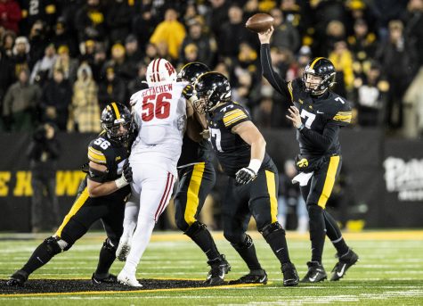 Iowa quarterback Spencer Petras throws a pass during a football game between Iowa and Wisconsin at Kinnick Stadium in Iowa City on Saturday, Nov. 12, 2022. Petras threw 23 passes and completed 14. The Hawkeyes, defeated the Badgers, 24-10.