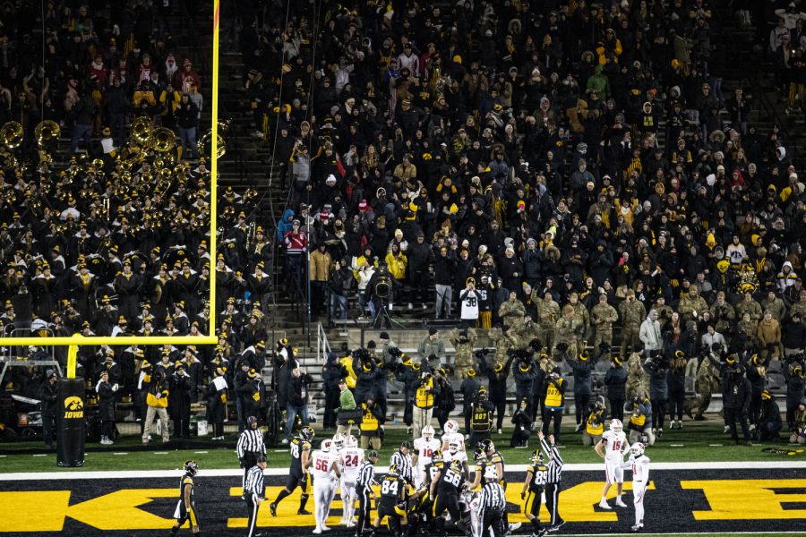 The+Iowa+offense+gets+up+after+scoring+a+touchdown+on+a+Iowa+quarterback+Spencer+Petras+sneak+during+a+football+game+between+Iowa+and+Wisconsin+at+Kinnick+Stadium+on+Saturday%2C+Nov.+12%2C+2022.+Petras+rushed+the+ball+eight+times+for+-41+yards+and+a+touchdown.+The+Hawkeyes+defeated+the+Badgers%2C+24-10.