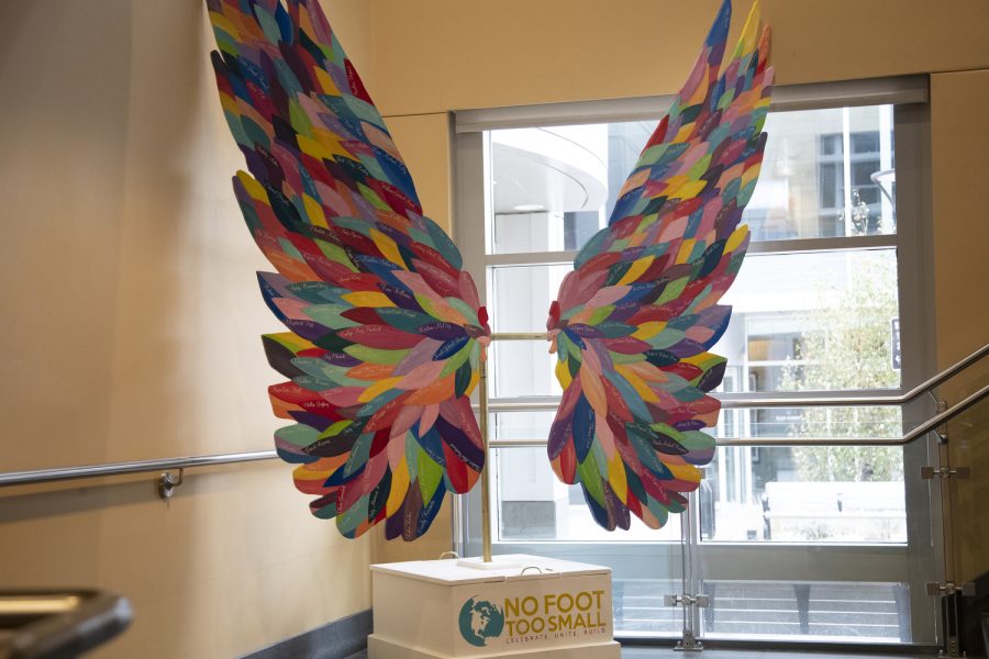 The No Foot Too Small art sculpture is seen at the Iowa City Public Library Nov. 18, 2022. ) The wings raise awareness for pregnancy and infant loss; each feather being someone lost.