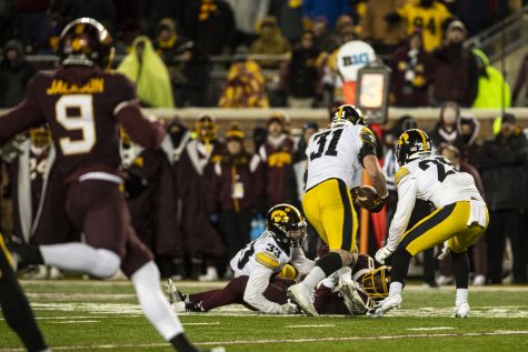 Iowa linebacker Jack Campbell intercepts a pass during a football game between Iowa and Minnesota at Huntington Bank Stadium in Minneapolis on Saturday, Nov. 19, 2022. Campbell returned the ball to the end zone. Officials later determined Campbell stepped out of bounds on the return. The Hawkeyes defeated the Gophers, 13-10.