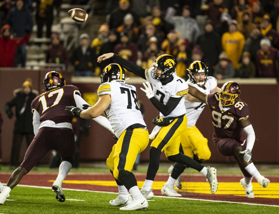 Iowa quarterback Spencer Petras throws a pass during a football game between Iowa and Minnesota at Huntington Bank Stadium in Minneapolis on Saturday, Nov. 19, 2022. Petras passed for 221 yards on 15 completions. The Hawkeyes defeated the Gophers, 13-10.