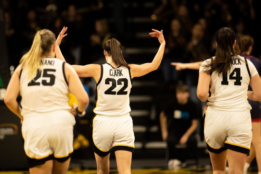 Iowa guard Caitlin Clark motions for the audience to make some noise during a women’s basketball game between Iowa and Belmont at Carver Hawkeyes Arena in Iowa City on Sunday Nov. 20, 2022. The Hawkeyes defeated the Bruins 73-62.