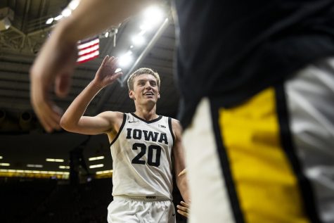 Iowa guard Payton Sandfort high fives teammates while coming off the floor during a basketball game between Iowa and Omaha at Carver-Hawkeye Arena on Monday, Nov. 21, 2022. Sandfort recorded eight points. The Hawkeyes defeated the Mavericks, 100-64.