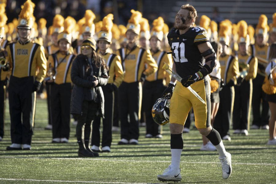 Iowa linebacker Jack Campbell runs outs before a football game between Iowa and the Nebraska at Kinnick Stadium on November 25, 2022.  The Cornhuskers defeated the Hawkeyes, 24-17.