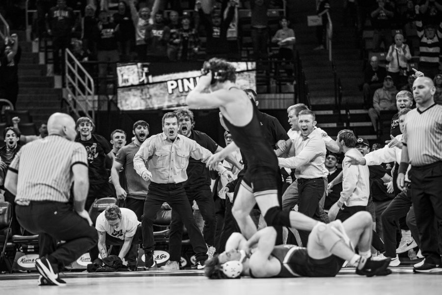 The Hawkeyes celebrate a victory from Iowas No. 29 157-pound Cobe Siebrecht over Penn’s No. 20 157-pound Anthony Artalona during a wrestling meet between No. 2 Iowa and No. 21 Penn at Carver-Hawkeye Arena in Iowa City on Saturday, Nov. 26, 2022. Siebrecht defeated Artalona by fall in four minutes and two seconds. The Hawkeyes defeated the Quakers, 26-11.