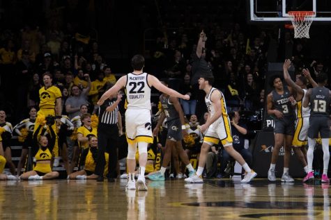 Iowa forwards Patrick McCaffery and Filip Rebraca celebrate during a basketball game between Iowa and Georgia Tech on Nov. 29, 2021, at Carver-Hawkeye Arena. The Hawkeyes defeated the Yellow Jackets, 81-65.