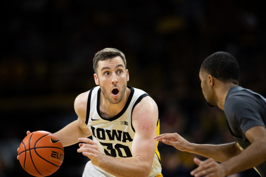 Iowa guard Connor McCaffery moves with the ball during a basketball game between Iowa and Georgia Tech at Carver-Hawkeye Arena on Tuesday, Nov. 29, 2022. The Hawkeyes defeated the Yellow Jackets, 81-65.
