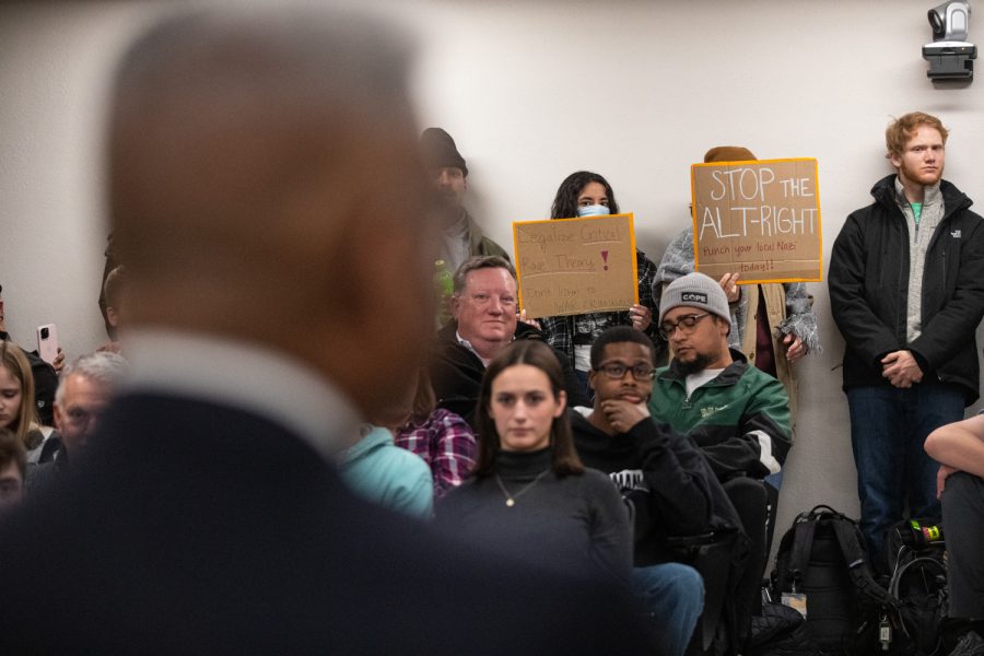 Protesters and fans listen to Allen West speak at a Young Americans for Freedom event on Wednesday, Nov. 30, 2022.