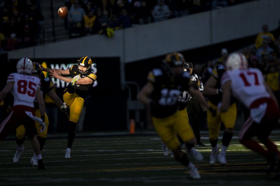 Iowa punter Tory Taylor punts the ball during a football game between Iowa and Nebraska at Kinnick Stadium on Friday, Nov. 25, 2022. The Huskers lead the Hawkeyes at halftime, 17-0. (Ayrton Breckenridge/The Daily Iowan)