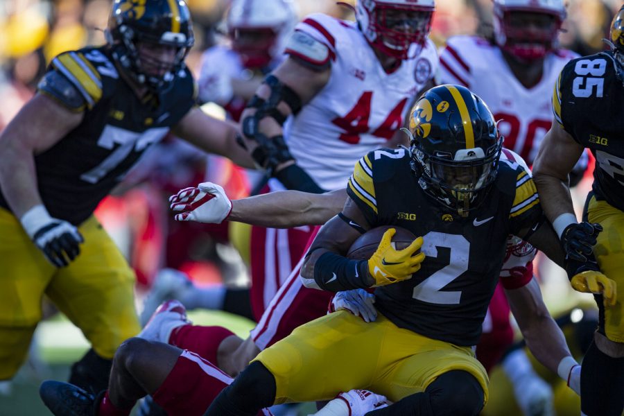 Iowa running back Kaleb Johnson dives for more yards during a football game between Iowa and Nebraska at Kinnick Stadium on Friday, Nov. 25, 2022. The Huskers lead the Hawkeyes at halftime, 17-0. (Ayrton Breckenridge/The Daily Iowan)