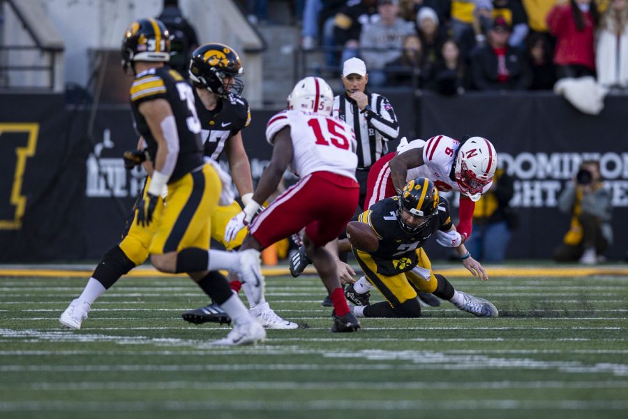 Iowa quarterback Spencer Petras fumbles the ball during a football game between Iowa and Nebraska at Kinnick Stadium on Friday, Nov. 25, 2022. The Huskers lead the Hawkeyes at halftime, 17-0. (Ayrton Breckenridge/The Daily Iowan)