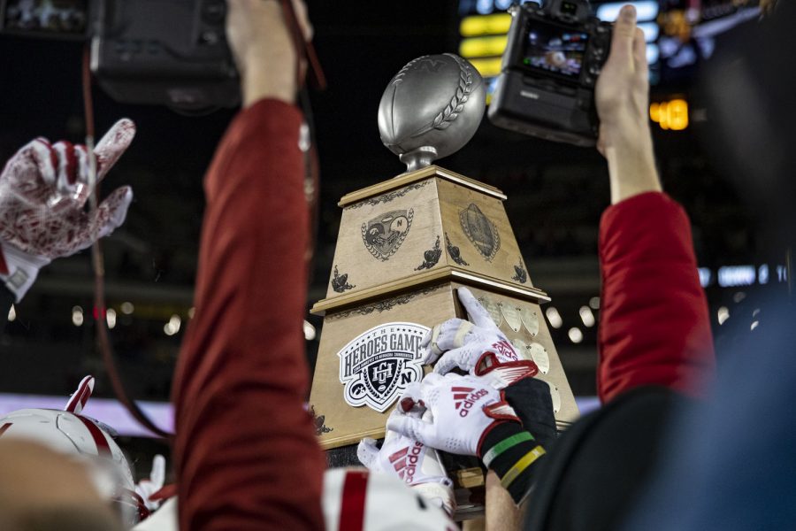 Nebraska players lift the Heroes trophy after a football game between Iowa and Nebraska at Kinnick Stadium on Friday, Nov. 25, 2022. The Huskers defeated the Hawkeyes, 24-17. 