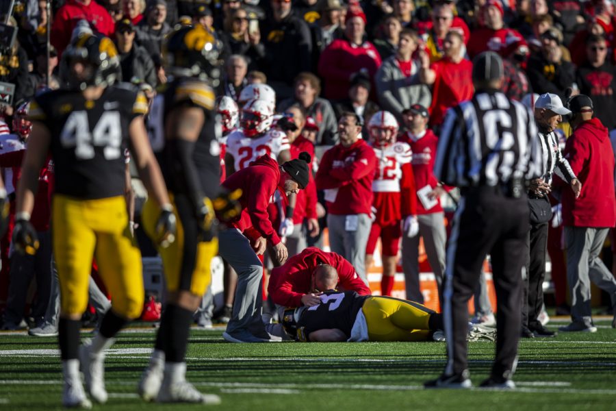 Iowa defensive back Cooper DeJean lays on the ground after sustaining an injury during a football game between Iowa and Nebraska at Kinnick Stadium on Friday, Nov. 25, 2022. The Huskers defeated the Hawkeyes, 24-17. 