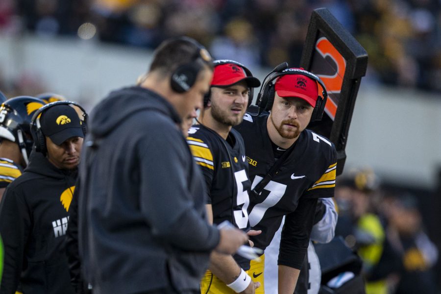 Iowa quarterback Spencer Petras looks at Iowa offensive coordinator Brian Ferentz during a football game between Iowa and Nebraska at Kinnick Stadium on Friday, Nov. 25, 2022. Petras was taken out for a suspected injury during the first quarter. The Huskers lead the Hawkeyes at halftime, 17-0.