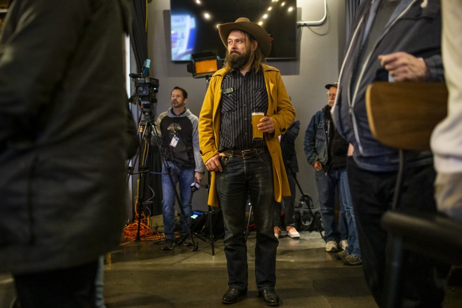 Johnson County Board of Supervisors seat Jon Green watches the poll results during a watch party on Election Day at Big Grove Brewery &amp; Taproom in Iowa City, on Tuesday, Nov. 8, 2022. (Grace Smith/The Daily Iowan)