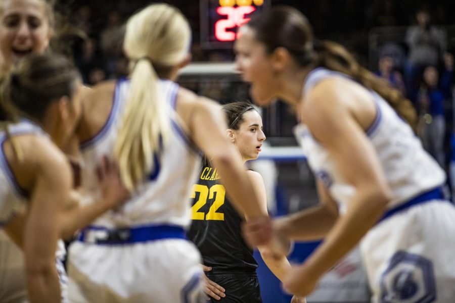 Iowa guard Caitlin Clark watches Drake celebrate during a basketball game between Iowa and Drake at the Knapp Center in Des Moines, Iowa, on Sunday, Nov. 13, 2022.