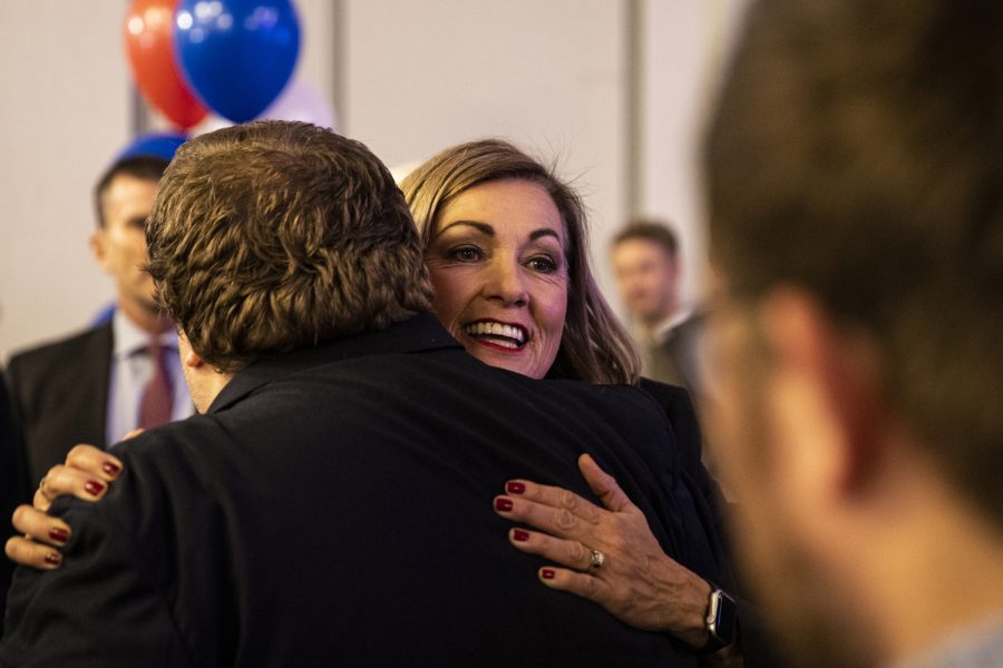 Iowa Governor Kim Reynolds celebrates with Caleb Primrose after winning reelection during a watch party for Iowa Republicans on Election Day at the Hilton Downtown in Des Moines on Tuesday, Nov. 8, 2022.