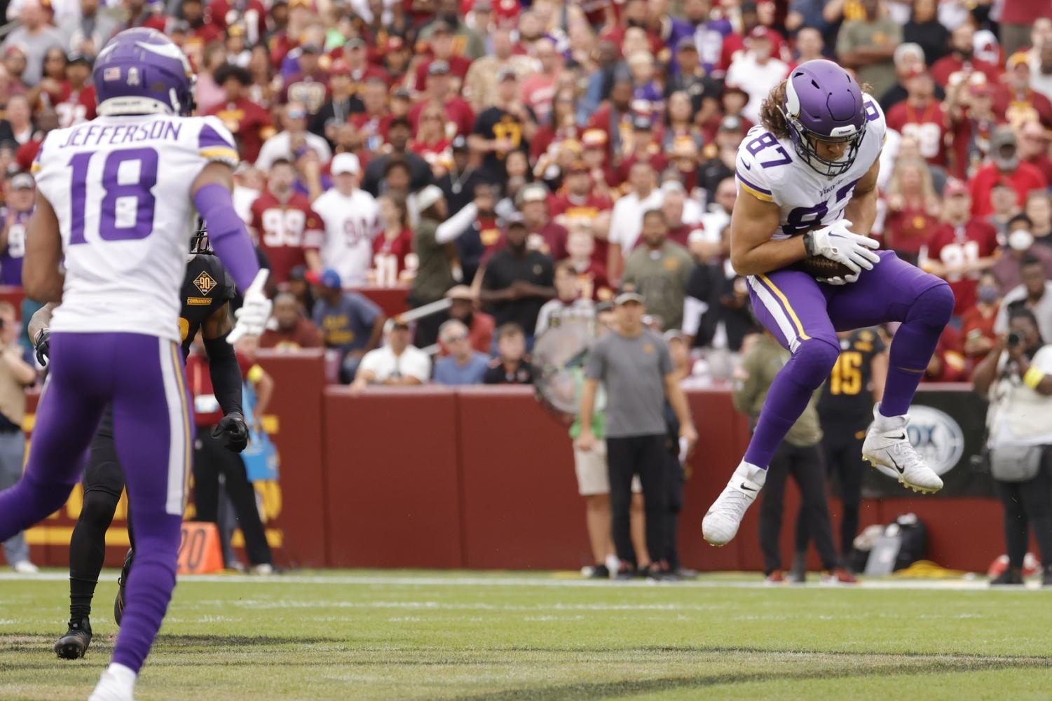 Minnesota Vikings tight end T.J. Hockenson (87) running with the ball  before the start of an