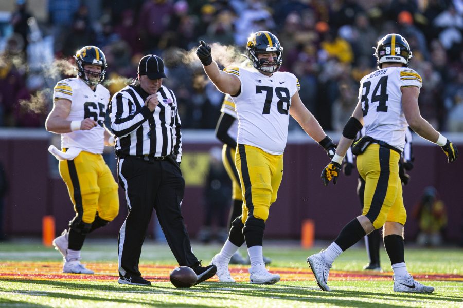 Iowa offensive lineman Mason Richman celebrates a first down from tight end Sam LaPorta during a football game between Iowa and Minnesota at Huntington Bank Stadium in Minneapolis on Saturday, Nov. 19, 2022.