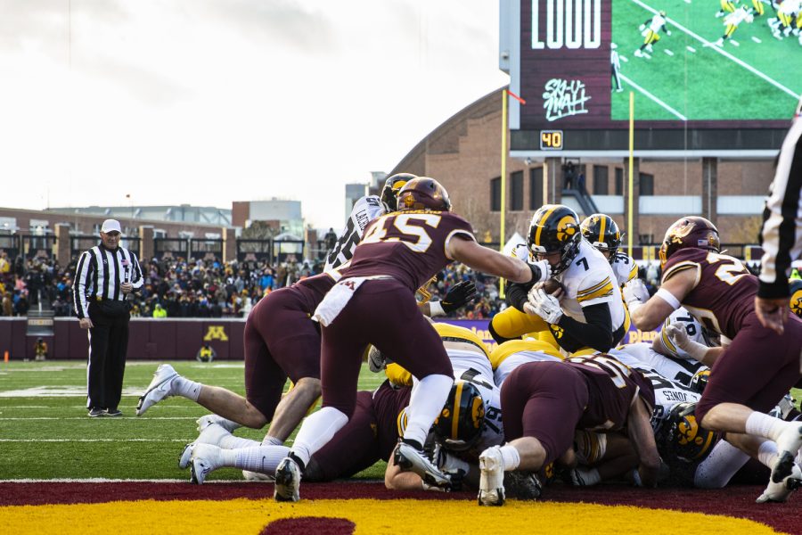 Iowa+quarterback+Spencer+Petras+dives+in+for+a+touchdown+during+a+football+game+between+Iowa+and+Minnesota+at+Huntington+Bank+Stadium+in+Minneapolis+on+Saturday%2C+Nov.+19%2C+2022.+%28Jerod+Ringwald%2FThe+Daily+Iowan%29