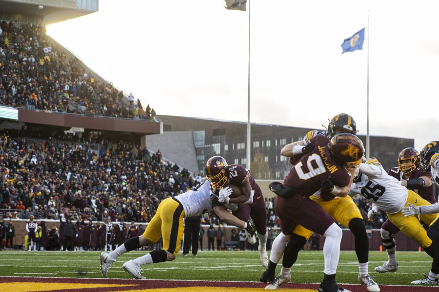 Minnesota running back Mohamed Ibrahim breaks a tackle from Iowa linebacker Jack Campbell to get into the end zone during a football game between Iowa and Minnesota at Huntington Bank Stadium in Minneapolis on Saturday, Nov. 19, 2022. (Jerod Ringwald/The Daily Iowan)