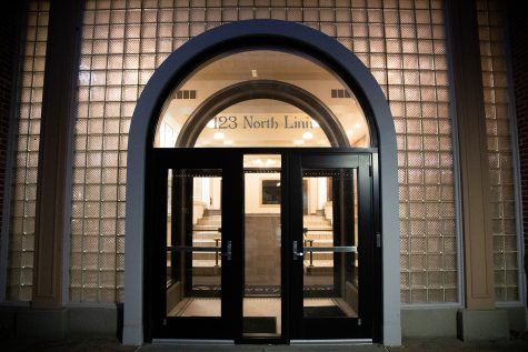 The front door of 123 North Linn Street is seen through a window on Saturday Nov. 19, 2022.